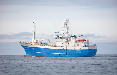 Fototapeta na wymiar Husavik, Iceland on August 2, 2021: Commercial pelagic fishing vessel fishing in Icelandic waters