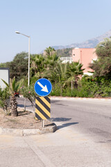 traffic safety signs on city street road. direction movement sign outdoor. danger warning symbol on...