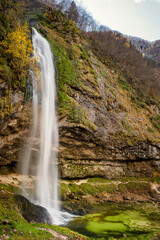Beautiful autumn scene at Goriuda waterfall in the Julian Alps. Chiusaforte, Udine province, Friuli Venezia Giulia, Italy.