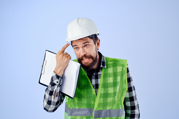 male builder in a green vestconstruction work design blue background