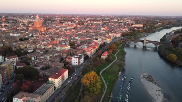 Drone view of the medieval city of Pavia in Italy : flyng over Ticino river and Old Town