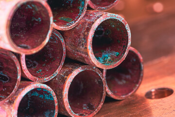 Old copper pipe with corrosion oxidation