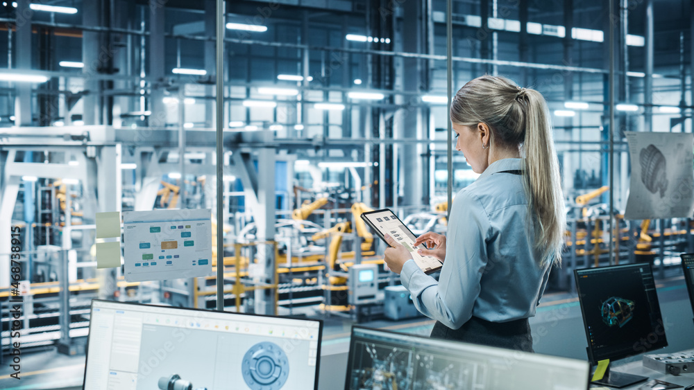 Poster Car Factory Office Concept: Female Chief Automotive Engineer Using Tablet Computer to Develop, Design and Optimize Efficiency of Automated Robot Arm Assembly Line Manufacturing Electric Vehicles. 