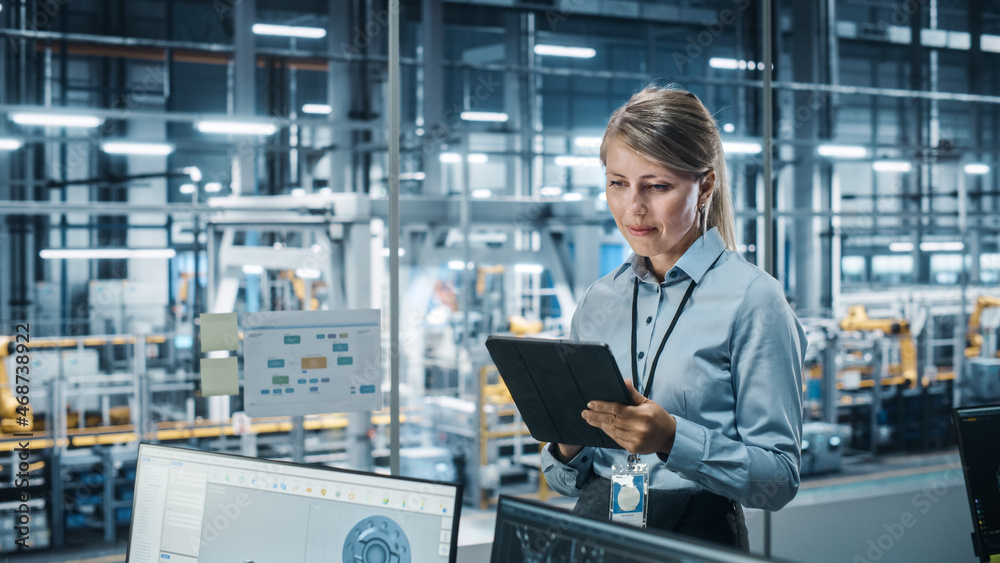 Leinwandbilder car factory office concept: portrait of successful female chief automotive engineer using tablet com
