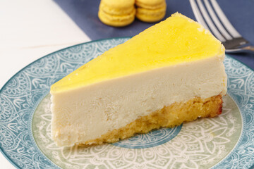 Lemon cheesecake on the plate close up