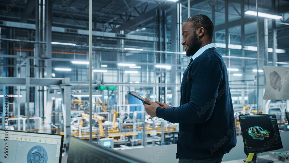 Aufkleber car factory office: portrait of successful black male chief engineer using tablet computer in automa