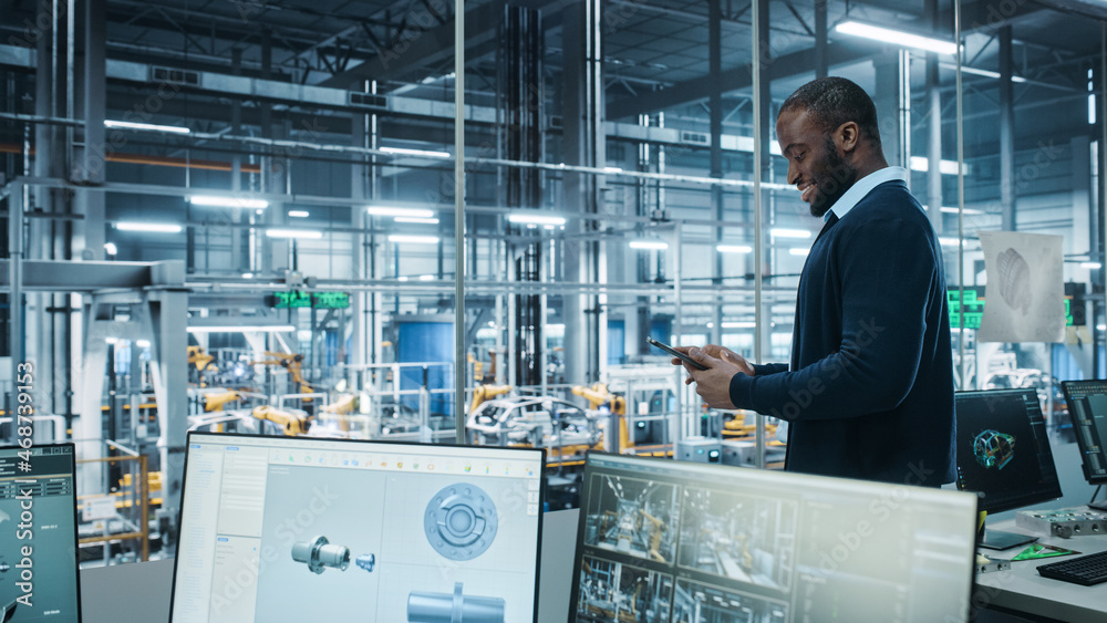 Poster Car Factory Office: Portrait of Successful Black Male Chief Engineer Using Tablet Computer in Automated Robot Arm Assembly Line Manufacturing High-Tech Electric Vehicles. Side View Shot