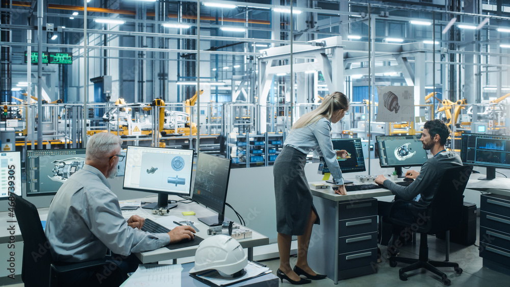 Poster Car Factory Office: Project Manager Talks to Engineer Working on Computer. CAD Software, 3D Turbine Engine, Electric Car. Automated Robot Arm Assembly Line Manufacturing Vehicles. Wide Shot