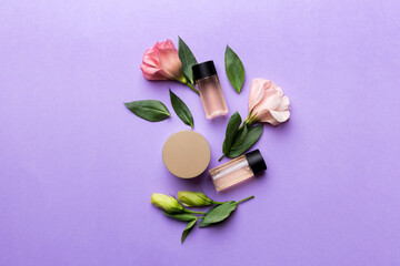 Composition with cosmetic products and beautiful roses on color background. Flat lay