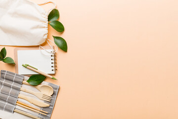 set of empty reusable disposable eco-friendly plates, cups, utensils on light white colored table background. top view. Biodegradable craft dishes. Recycling concept. Close-up