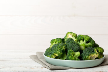 broccoli of fresh green broccoli in bowl over coloredbackground. , close up. Fresh vegetable