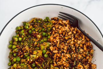 vegan broccoli and peas stiry fry with teriyaki sauce shredded tofu, healthy plant-based food