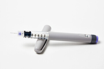 Insulin pen with insulin medicine on white background - obrazy, fototapety, plakaty