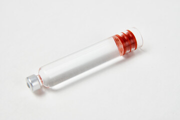 Medical vaccine ampoules on white background