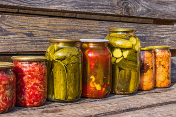Preservation of vegetables in banks. Fermentation products. Harvesting cucumbers and tomatoes for the winter.