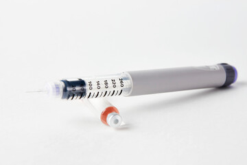 Insulin pen with insulin medicine on white background
