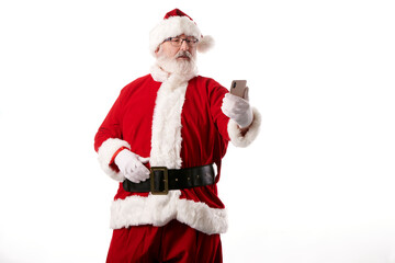 Fototapeta na wymiar Santa Claus taking a selfie with a mobile phone on a white background
