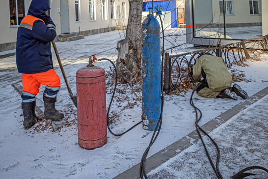 The Repair Crew Restores The Metal Sidewalk Fence After The Accident