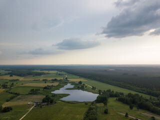 countryside fields and roads under cloudy sky