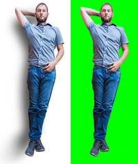 Young caucasian man in casual clothes lying on green screen and white background with shadow. Top view