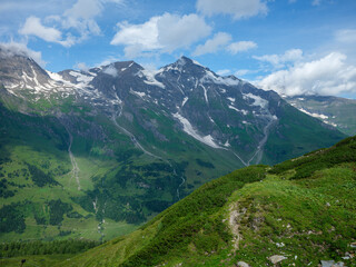Fototapeta na wymiar summer green Alps mountains in Austria with snowy peaks