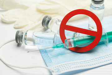 No vaccine. Anti-vaccination. Syringe with vaccine and prohibition sign