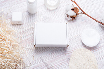 Fototapeta na wymiar White cardboard, carton boxes on wooden table, for cosmetic small business