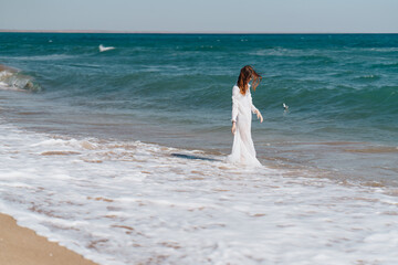 Fototapeta na wymiar Woman in white dress near the ocean walk fresh air landscape