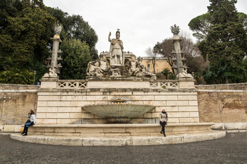 Fototapeta na wymiar Fontana della Dea di Roma in Piazza del Popolo (People's Square). Rome, Italy