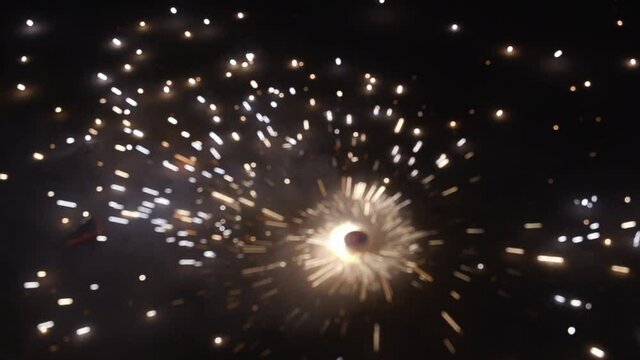 Slow Motion shot of firework known as Chakra  rotating on the ground, during the Diwali festival celebrations in India