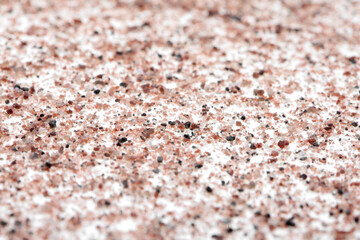 Black and pink volcanic salt on white background