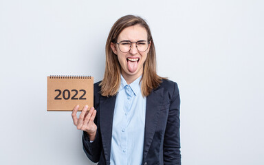 young pretty woman with cheerful and rebellious attitude, joking and sticking tongue out. calendar...