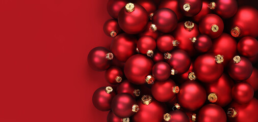 Christmas decorations, top view of pile of glass balls colored in red, isolated on red background,...