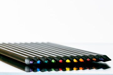 Naklejka premium Black pencils with reflection
