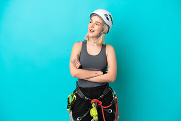 Young caucasian rock-climber woman isolated on white background happy and smiling