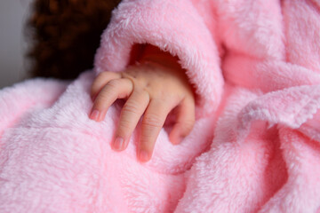 baby hand in pink