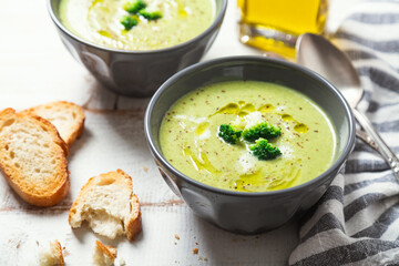 Bowls of healthy  broccoli cream soup