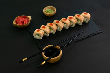 Grilled Philadelphia roll sushi with salmon, prawn, avocado, cream cheese. Sushi menu. Japanese food.