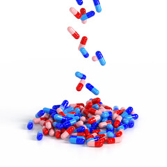 Medicinal capsules falling from above in a heap on a white background. Production of drugs. Medical theme. 3d rendering. 