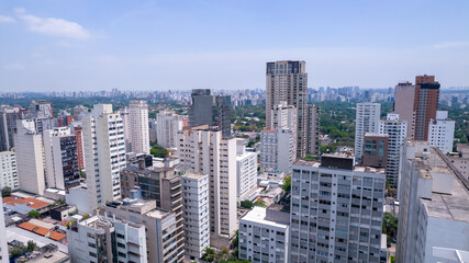 Aerial view of Jardins district in São Paulo, Brazil. Big residential and commercial buildings in a prime area near Av. Paulista with Ibirapuera Park on background. 