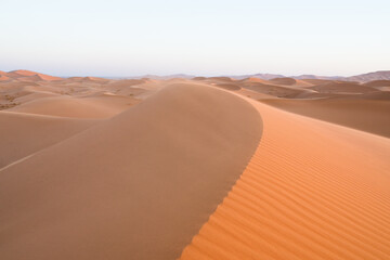 Fototapeta na wymiar Red sand dunes of the Merzouga desert, Morocco