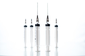 A 5ml syringe and needle isolated on a white background with detailed clipping path.