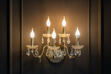 An antique designer lamp hangs on the wall