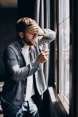 Man drinker depressed with bottle of whiskey