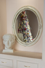 Reflection of a beautiful fabulous Christmas tree in the mirror