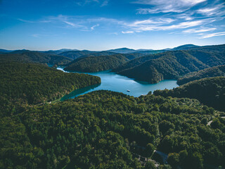 Fototapeta na wymiar Aerial view of blue lakes and and hills with green forests in Croatia