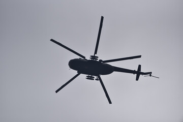 military helicopter against the sky
