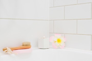 White Background Bath Candle Plumeria Flower Bamboo Face Brush SPA at Home Concept Horizontal