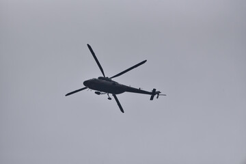 Fototapeta na wymiar military helicopter against the sky