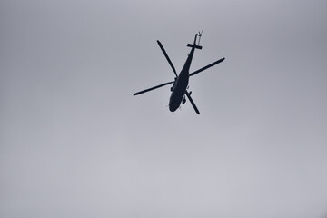 military helicopter against the sky